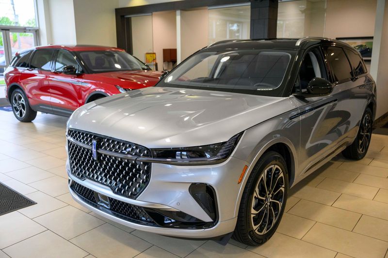 A pair of 2026 Lincoln Nautilus luxury vehicles are displayed in the showroom at the Bob Maxey Lincoln dealership in Detroit on Tuesday, May 5, 2026. The Lincoln luxury brand's best-selling vehicle has a VIN starting with 5 despite being assembled in China.