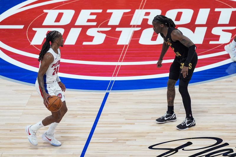 Detroit Pistons guard Daniss Jenkins (24) dribbles against Cleveland Cavaliers guard Keon Ellis (14) during the first half of Game 1 of second round of NBA playoffs at Little Caesars Arena in Detroit on Tuesday, May 5, 2026.