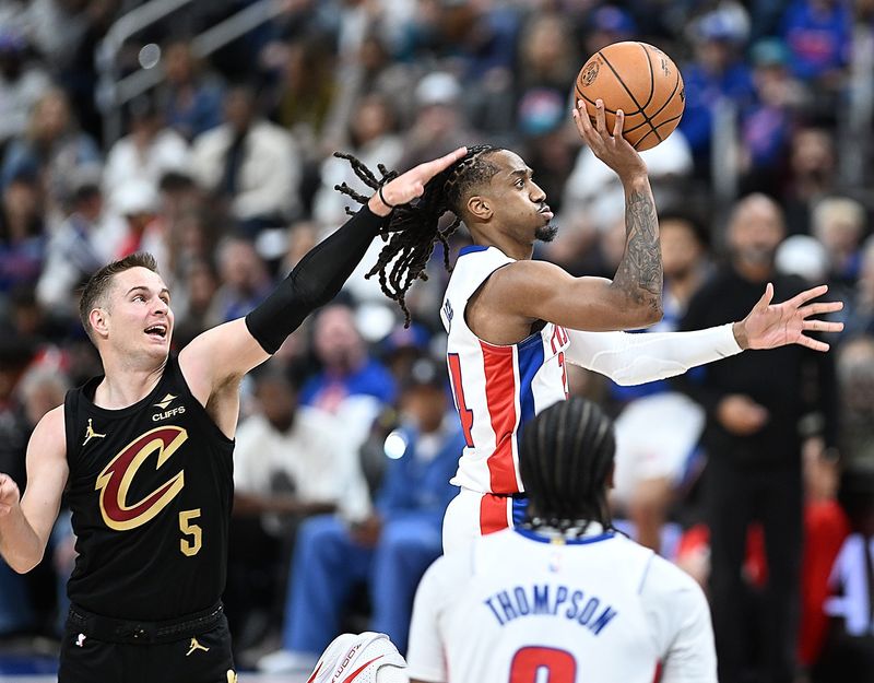 Detroit Pistons guard Daniss Jenkins (24) shoots over Cleveland Cavaliers guard Sam Merrill (5) in the first half. Detroit Pistons vs Cleveland Cavaliers, Round 2, Game 1, at Little Caesars Arena on Tuesday, May 5, 2026, in Detroit, Mich