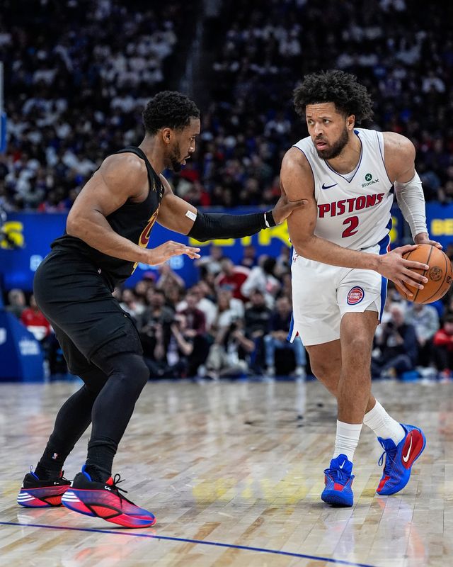 Detroit Pistons guard Cade Cunningham (2) dribbles against Cleveland Cavaliers guard Donovan Mitchell (45) during the second half of Game 1 of second round of NBA playoffs at Little Caesars Arena in Detroit on Tuesday, May 5, 2026.