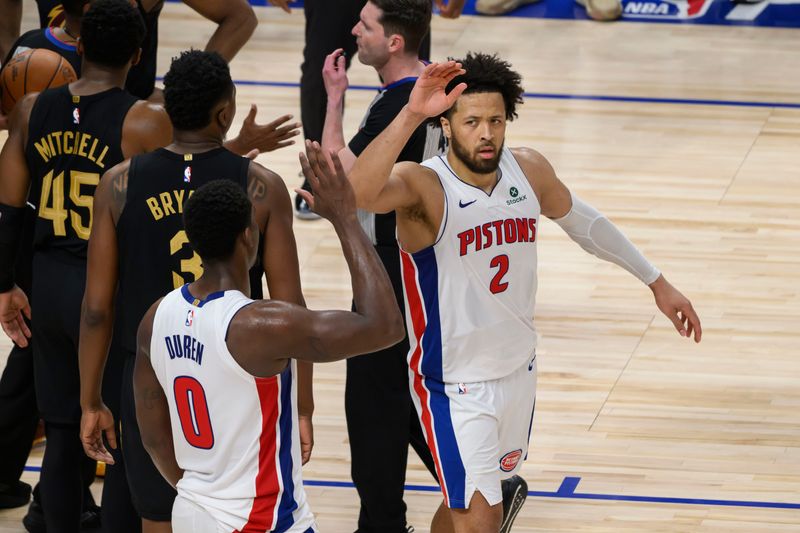 Pistons center Jalen Duren (0) and guard Cade Cunningham celebrate during the fourth quarter of Tuesday's Game 1 win over the Cavaliers.