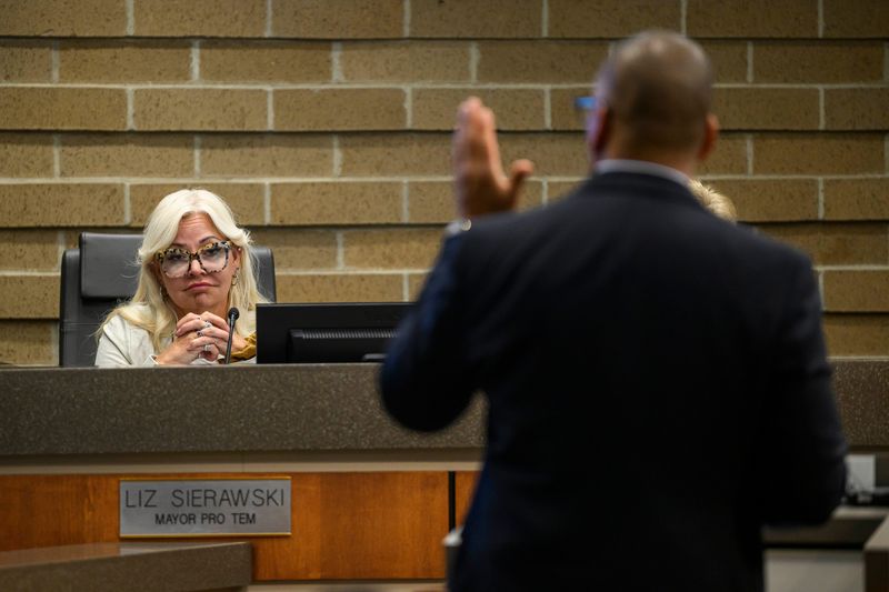 Sterling Heights Mayor Pro Tem Liz Sierawski, left, listens as Colin Carby, Director of Development for Lionheart Capital, right, gives a presentation about a plan to redevelop Lakeside Mall on M-59 into a mixed-use development with housing, restaurants, shops and more during a meeting of Sterling Heights City Council on Tuesday, May 5, 2026 at City Hall in Sterling Heights, Mich.