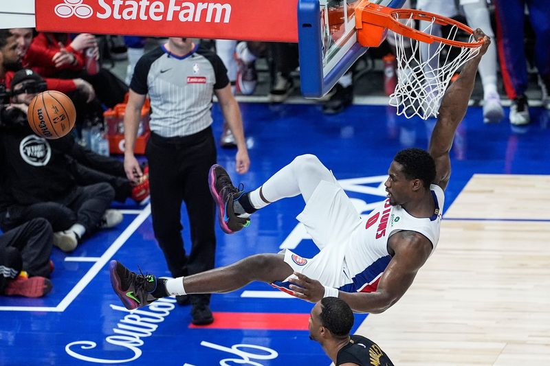 Detroit Pistons center Jalen Duren dunks past Cleveland Cavaliers center Evan Mobley during the second half of Game 1 of the second round of the NBA playoffs at Little Caesars Arena in Detroit on Tuesday, May 5, 2026.