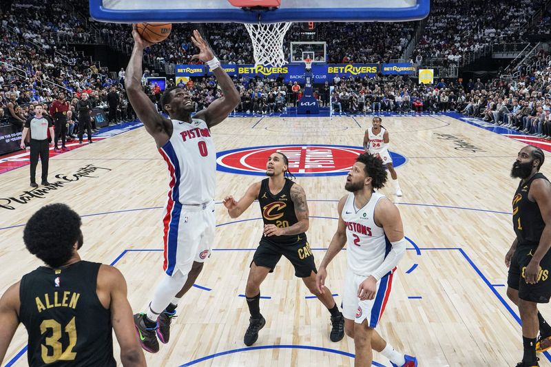 Detroit Pistons center Jalen Duren dunks past Cleveland Cavaliers guard Jaylon Tyson (20) and center Jarrett Allen (31) during the second half of Game 1 of the second round of the NBA playoffs at Little Caesars Arena in Detroit on Tuesday, May 5, 2026.