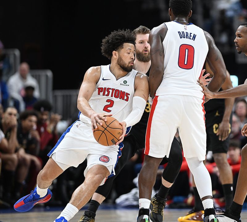 Detroit Pistons guard Cade Cunningham (2) drives around Cleveland Cavaliers forward/center Dean Wade (32) in the second half. Detroit Pistons vs Cleveland Cavaliers, Round 2, Game 1, at Little Caesars Arena on Tuesday, May 5, 2026, in Detroit, Mich