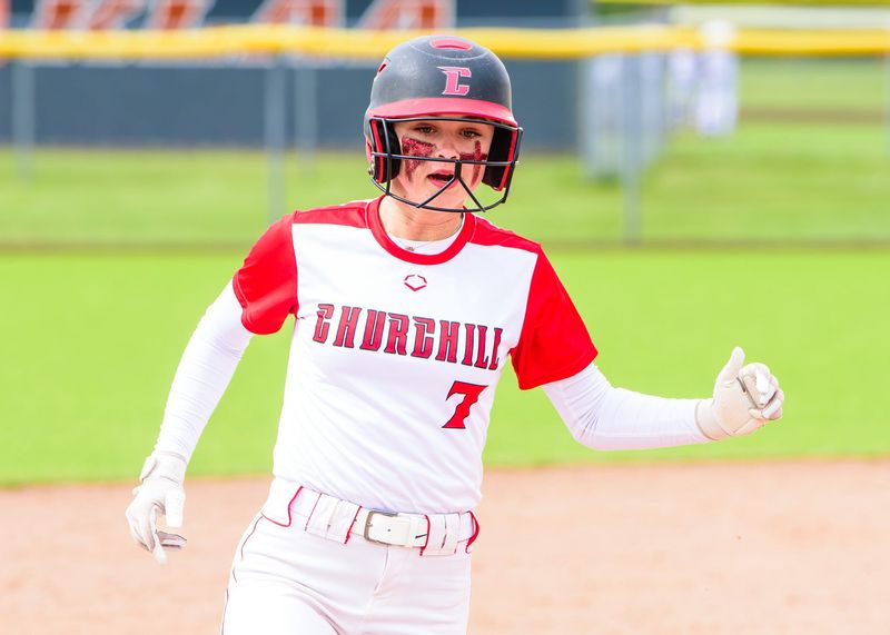 Livonia Churchill's Emma Karbowski races to third base during a Kensington Lakes Activities Association-East softball game on Wednesday, May 6, 2026.