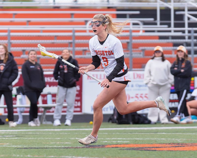 Brighton's Quinn Holdridge, who had four goals and two assists, rushes up the field during an 11-5 victory over Hartland Wednesday, May 6, 2026.