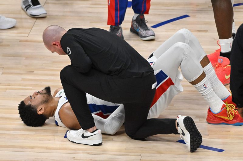 Detroit Pistons forward Tobias Harris is attended to after sustaining an injury during Game 2 of Round 2 of the NBA playoffs against the Cleveland Cavaliers on Thursday, May 7, 2026 at Little Caesars Arena in Detroit, Mich.