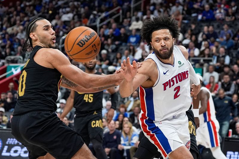 Detroit Pistons guard Cade Cunningham (2) and Cleveland Cavaliers guard Jaylon Tyson (20) battle for the rebound during the first half of Game 2 of second round of NBA playoffs at Little Caesars Arena in Detroit on Thursday, May 7, 2026.