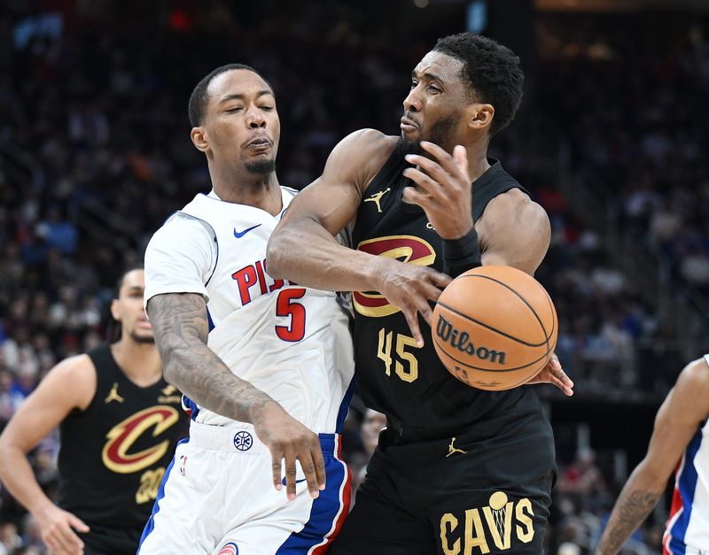 Detroit Pistons forward Ronald Holland II (5) knocks the ball from Cleveland Cavaliers guard Donovan Mitchell (45) during the first half of Game 2 in Round 2 of the NBA playoffs on Thursday, May 7, 2026, at Little Caesars Arena in Detroit, Mich.