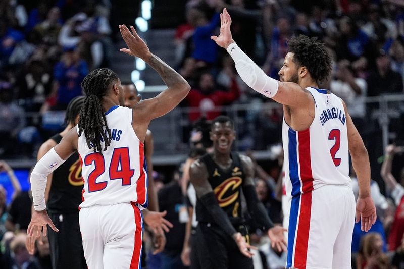 Detroit Pistons guard Daniss Jenkins (24) celebrates a three point basket against Detroit Pistons guard Cade Cunningham (2) during the second half of Game 2 of second round of NBA playoffs at Little Caesars Arena in Detroit on Thursday, May 7, 2026.