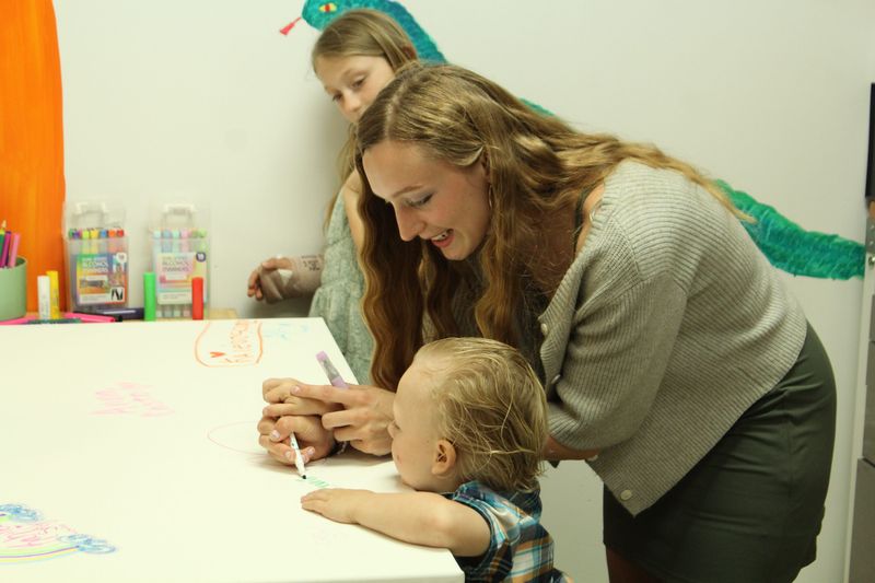 Anna Casto and her son, Levi, participate in the grand opening of Kaleidoscope Play & Create near Howell on April 24, 2026.
