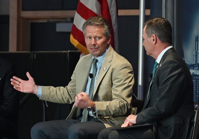 The salary of Michigan State University President Kevin Guskiewicz, left, was nearly doubled to $2 million a year during a special Sunday, May 17, 2026 meeting of the MSU Board of Trustees. A George Mason University higher education expert said the move left a lot of questions unanswered.