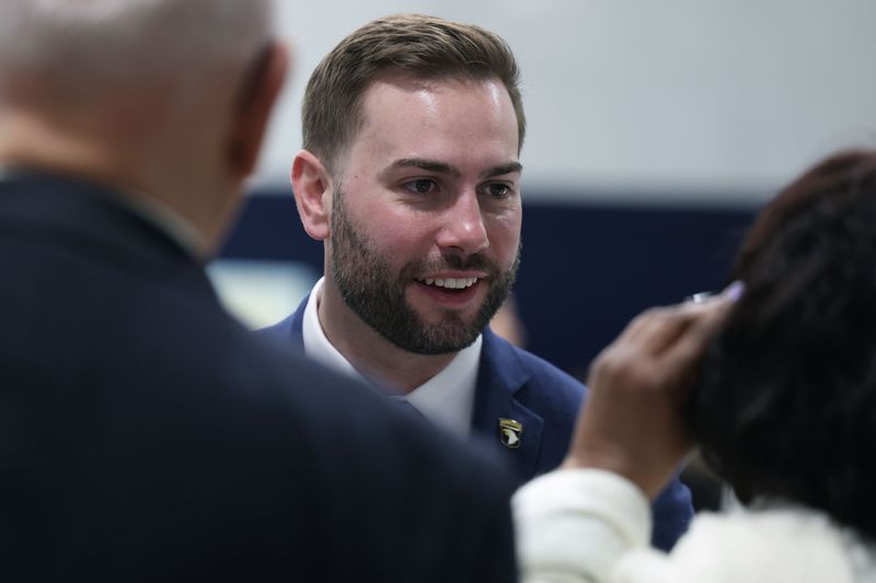 Michael Bouchard, a GOP candidate for Michigan’s 10th Congressional district, meets with Felicia Johnson at the Breakfast of Nations 2026 at the Chaldean Community Foundation, Friday, May 8, 2026 in Sterling Heights, Mich.