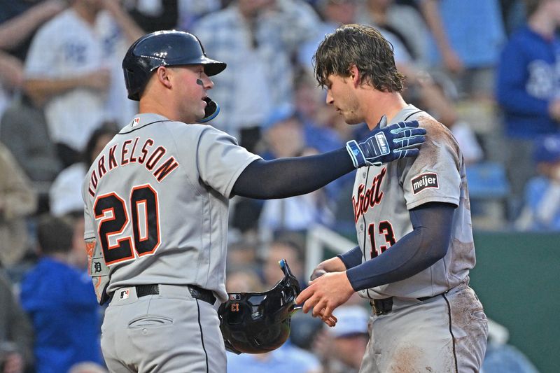 Tigers first baseman Spencer Torkelson (20) congratulates catcher Dillon Dingler (13) after scoring in the sixth inning against the Royals at Kauffman Stadium.