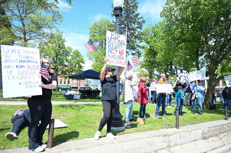 Demonstrators gathered near the Hillsdale County Courthouse on May 9 to protest a visit from Turning Point CEO Erika Kirk.