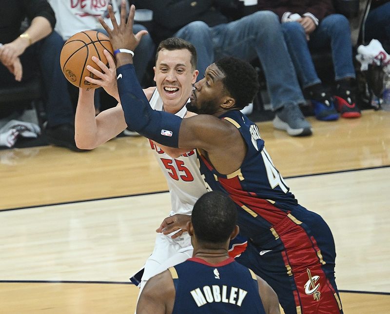 Pistons forward Duncan Robinson (55) is fouled by Cavaliers guard Donovan Mitchell (45) during the first half of Game 3.