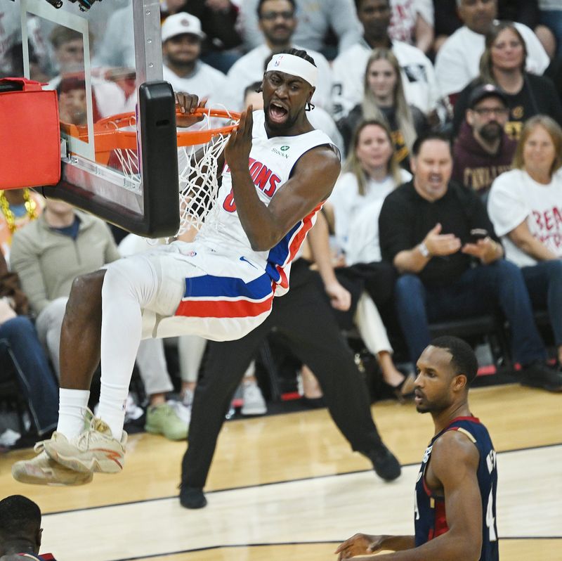 Pistons guard Caris LeVert (8) dunks over Cavaliers center Evan Mobley (4) in the first half of Game 3.