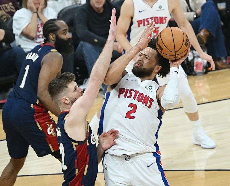 Pistons guard Cade Cunningham (2) shoots over Cavaliers forward/center Dean Wade (32) in the first half of Game 3.