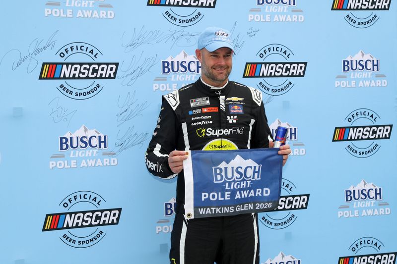 NASCAR Cup Series driver Shane Van Gisbergen stands with the Busch Light Pole Award after winning the pole for the Go Bowling at The Glen at Watkins Glen International.