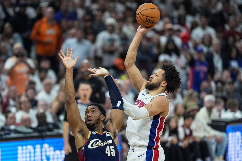 Detroit Pistons guard Cade Cunningham (2) makes a jump shot against Cleveland Cavaliers guard Donovan Mitchell (45) during the second half of Game 3 of second round of NBA playoffs at Rocket Arena in Cleveland on Saturday, May 9, 2026.
