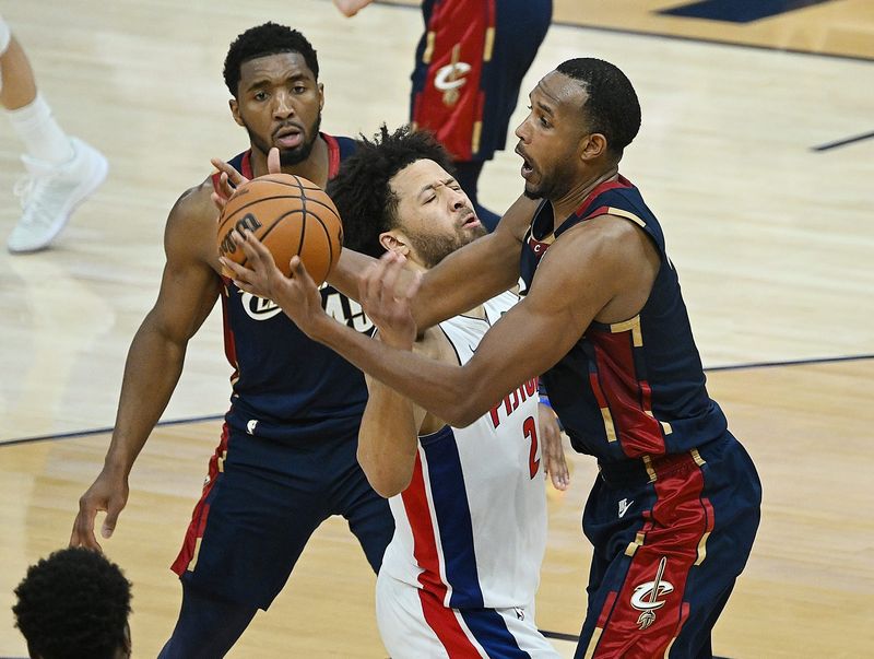 Cavaliers center Evan Mobley (4) steals the ball from Pistons guard Cade Cunningham (2) in the second half.