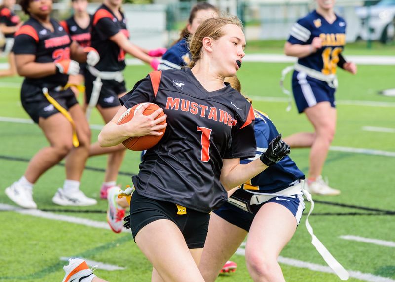 Northville's Taylor Chrzanowski rushes during a Michigan Girls High School Flag Football League game on Saturday, May 9, 2026.