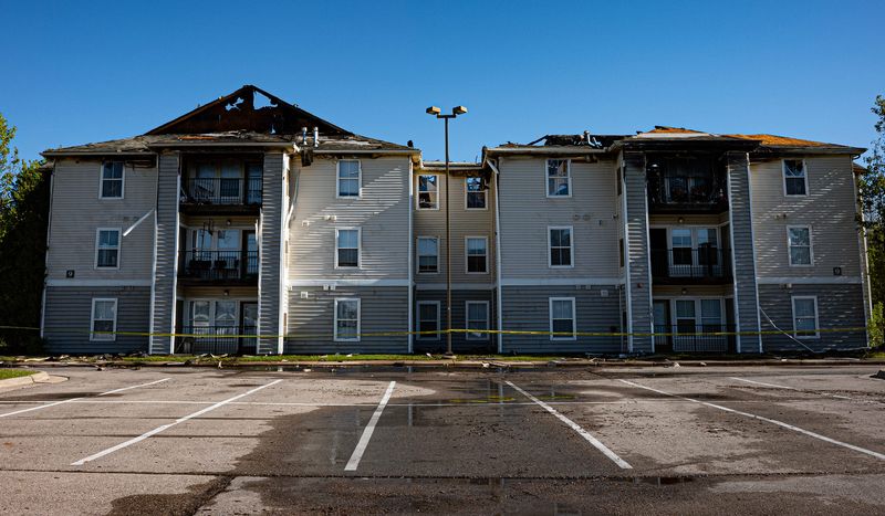 A view from the parking lot of Building 9 at 3839 Hunsaker Drive in East Lansing in the Village at Chandler Crossing apartment complex Sunday, May 10, 2026, after an overnight fire.