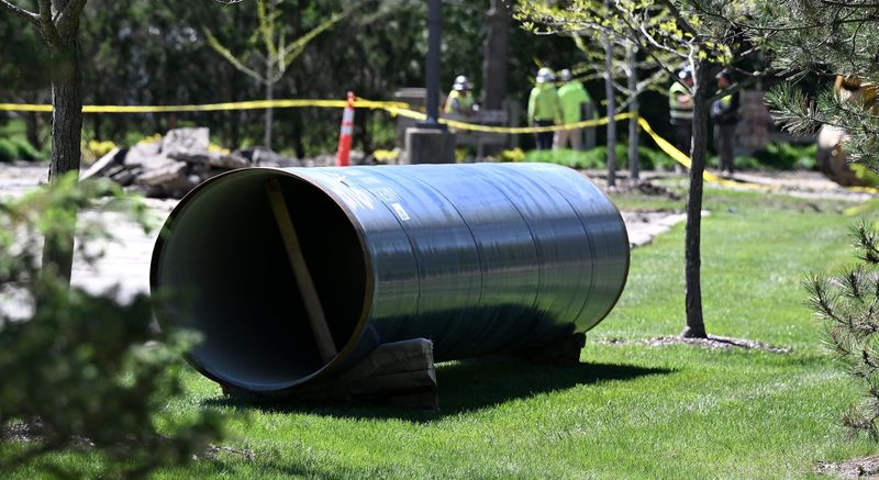 A new 42-inch water transmission main sits ready to be installed where a main is broken at River Woods Park on May 10, 2026 in Lake Orion, Mich.