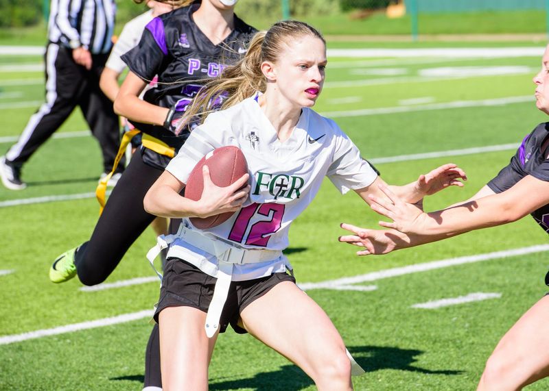 P-CEP's Reagan Fault rushes during a Michigan Girls High School Flag Football League game on Saturday, May 9, 2026.