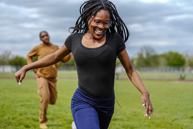 Delila Gooden, 16, of Detroit warms up on the track to prepare for a track meet at Detroit Osborn high school, Wednesday, May 6, 2026. Gooden started running as her first sport as a sophomore and broke the school record in the 800m in her first year.