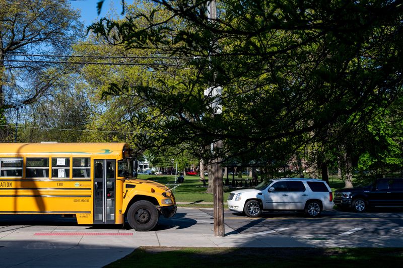 A Detroit Public Schools Community District school bus drives in front of Western International High School in Detroit on Friday, May 8, 2026.