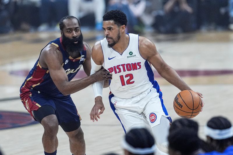 Detroit Pistons forward Tobias Harris (12) dribbles against Cleveland Cavaliers guard James Harden (1) during the first half of Game 4 of second round of NBA playoffs at Rocket Arena in Cleveland on Monday, May 11, 2026.