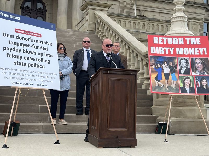 During a Tuesday, May 12, 2026, press conference in Lansing, Michigan Republican Party Chairman Jim Runestad calls on Democrats who received campaign contributions from Fay Beydoun to give the money to state government.