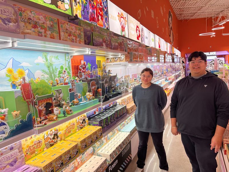 Brittany Lopez and Alexander Hernandez, employees of TESO Life, with some of the many collectibles available at the store, which opens May 15 at 42688 Grand River Avenue, Ste. 100, Novi.