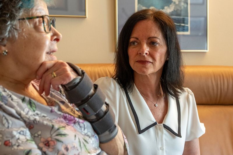 Geriatric care manager Stefanie Sinks, right, sits with Brecon Village resident Anita Rochefort, 74, while talking to the Detroit Free Press during an interview about how Sinks’ services as a care manager help people on Wednesday, April 22, 2026, at the residence in Saline.