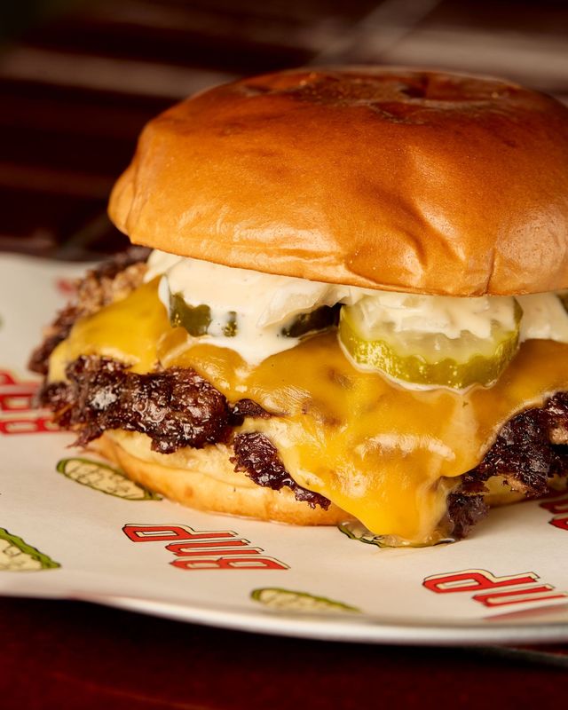 The Buns & Patties smash burger features two beef patties with cheese, pickles and house sauce at the new burger joint in Berkley offering late night hours.