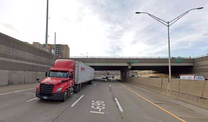 Traffic clears the Greenfield Road overpass along I-696.