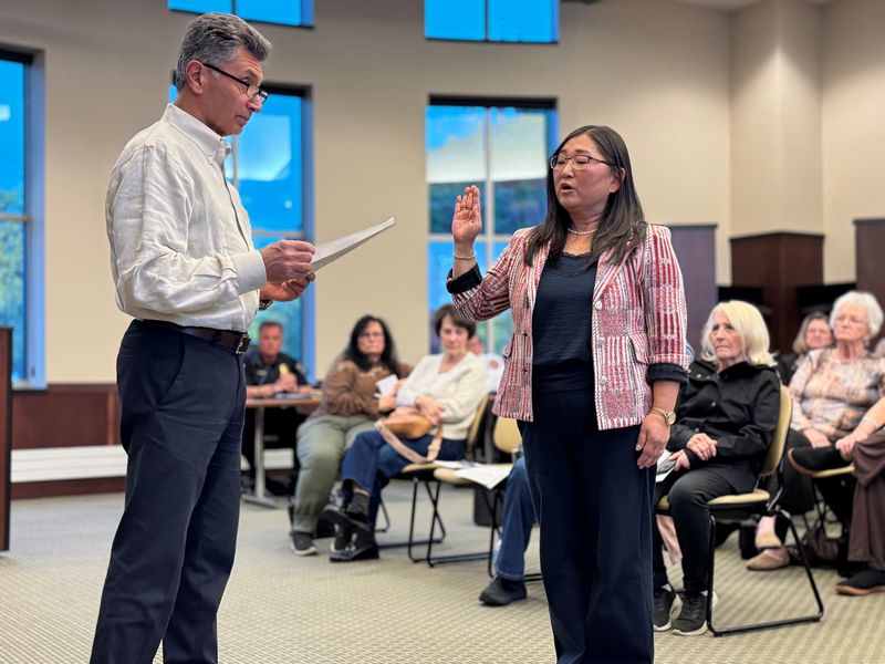 Plymouth Township Supervisor Chuck Curmi swears in Kim Gaedeke as township clerk at the May 12, 2026 meeting.