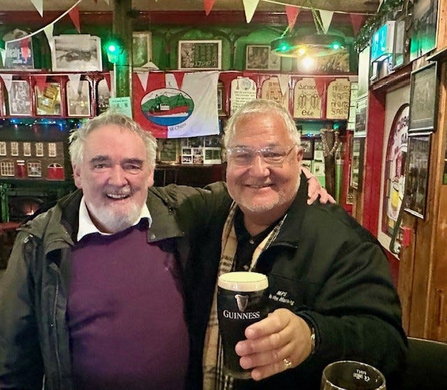 Michael Patrick Shiels with Fergus O’Flaherty, the guitar-playing, singing proprietor of the O’Flaherty’s pub.