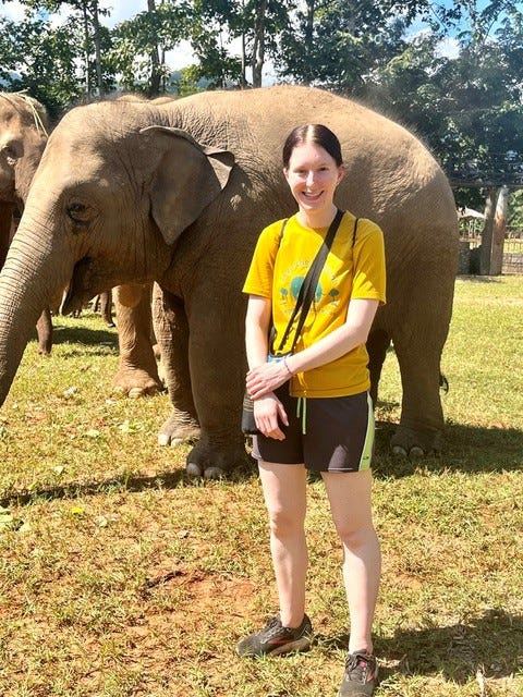 Kaitlyn Berg at an elephant sanctuary in Thailand. The Novi High School graduate died in 2025 after years of fighting brain tumors. The 2026 inaugural "A Taste of Milford" event will raise funds in her honor for the American Brain Tumor Association.