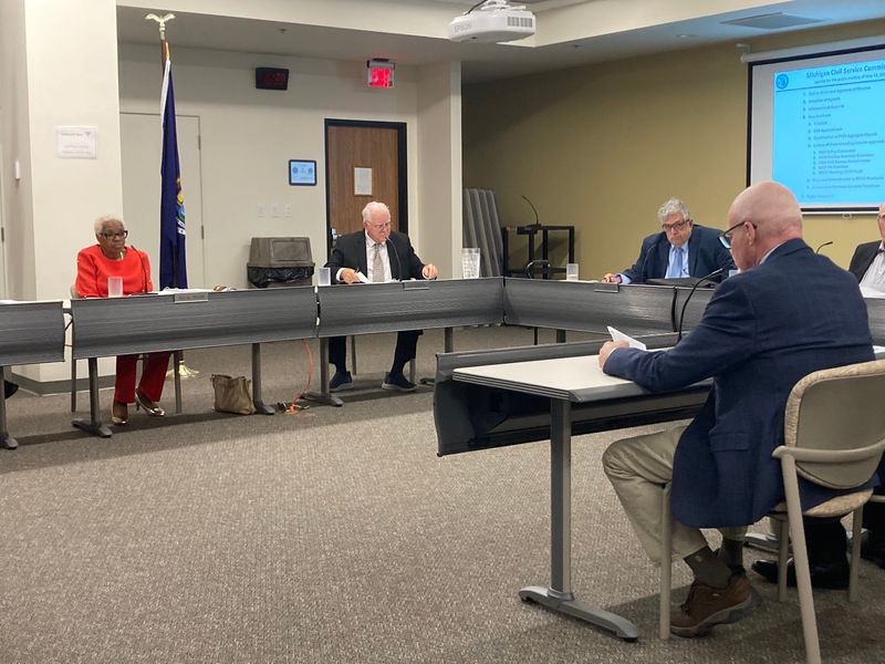 Kevin Karpinski of SEIU Local 517M makes a presentation to the Michigan Civil Service Commission on Wednesday, May 13, 2026. Shown from left are Commission Chair Gail Wilson, Commissioner Jeff Steffel, Commissioner Nick Ciaramitaro, and Karpinski.