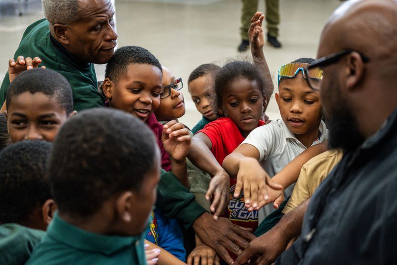 Yankees Baseball Organization president Sam Abrams, left, and coach Deandre Lomax, right, prepare to end a practice with members of the Yankees Baseball Organization during their first practice of the season at Noble Elementary-Middle School in Detroit on Tuesday, May 12, 2026. Since 1971, the Yankees Baseball Organization, a charter member organization of the Detroit Police Athletic League, has positively impacted thousands of young people on Detroit’s west side. 
The Yankees Baseball Organization name and mission is being carried on by a team of youngsters in age from 5-10 that attend the Detroit school to begin their baseball journeys, which hopefully will help to lead to success in life down the road. The organization is celebrating its 56th anniversary.