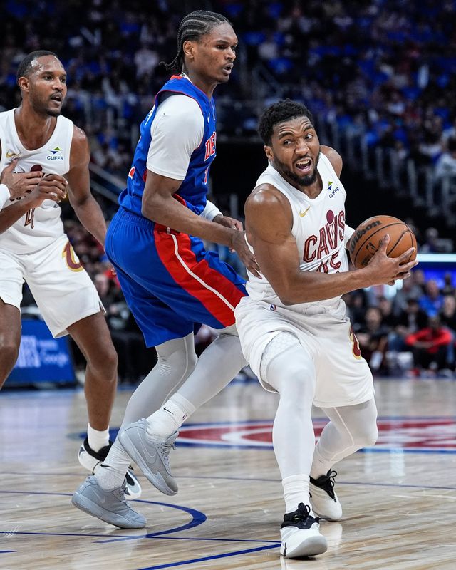 Detroit Pistons guard Ausar Thompson (9) defends Cleveland Cavaliers guard Donovan Mitchell (45) during the first half of Game 5 of second round of NBA playoffs at Little Caesars Arena in Detroit on Wednesday, May 13, 2026.