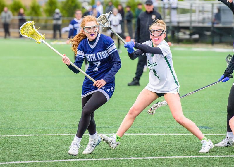 South Lyon United's Reagan Shields scores during a girls lacrosse game on Wednesday, May 13, 2026, at Lake Orion High School.