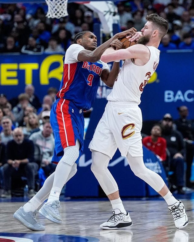 Detroit Pistons guard Ausar Thompson (9) and Cleveland Cavaliers forward Dean Wade (32) battle for the ball during the second half of Game 5 of second round of NBA playoffs at Little Caesars Arena in Detroit on Wednesday, May 13, 2026.