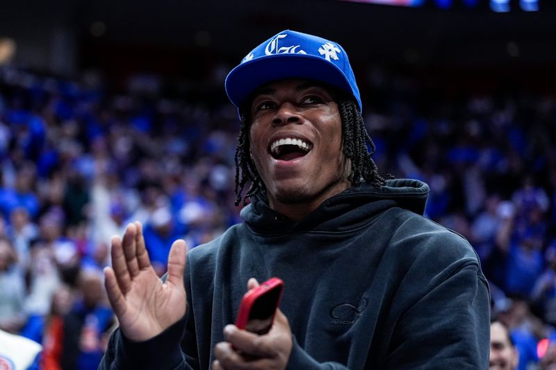 Detroit Lions running back Jahmyr Gibbs celebrates a play against Cleveland Cavaliers during the second half of Game 5 of second round of NBA playoffs at Little Caesars Arena in Detroit on Wednesday, May 13, 2026.