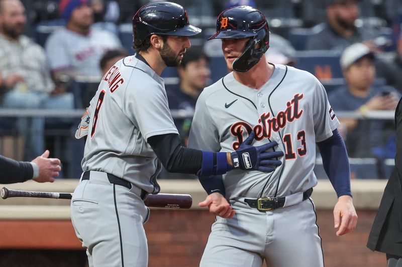 Tigers catcher Dillon Dingler (13) is greeted by center fielder Matt Vierling (8) after scoring in the first inning against the New York Mets on Wednesday at Citi Field.