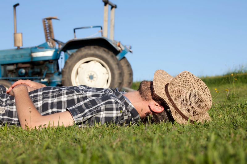 A farmer taking a nap.
