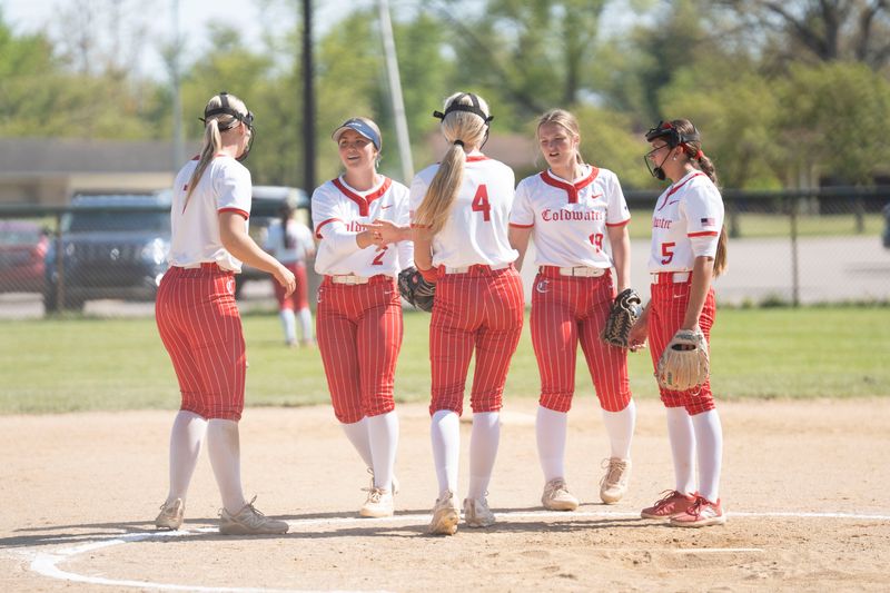 Coldwater players huddle up in the infield during a game at Pennfield High School on Thursday, May 14, 2026.